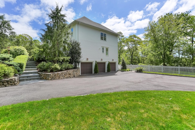 10 Easton Heights Ln, Easton, CT 06612 - view of property exterior featuring an attached garage, stairs, and asphalt driveway