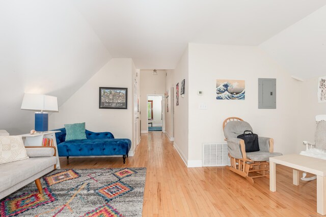76 Edwards St, New Haven, CT 06511 - living area with electric panel, lofted ceiling, light wood-style flooring, and baseboards