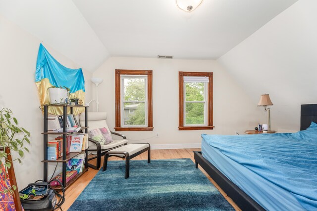 76 Edwards St, New Haven, CT 06511 - bedroom featuring lofted ceiling, wood finished floors, and baseboards