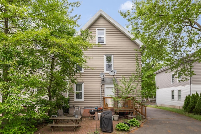 76 Edwards St, New Haven, CT 06511 - rear view of property featuring a deck and a patio