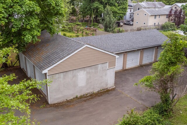 76 Edwards St, New Haven, CT 06511 - garage featuring fence and a residential view