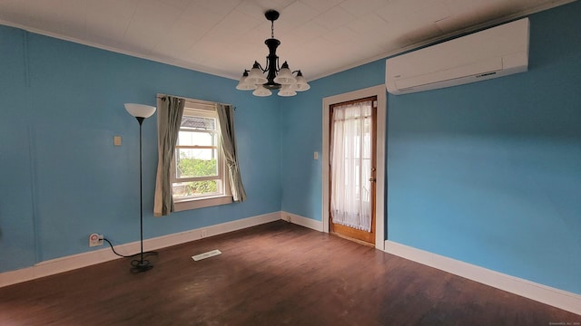 909 N Colony Rd, Meriden, CT 06450 - unfurnished room featuring a wall unit AC, dark wood-style floors, a chandelier, baseboards, and crown molding