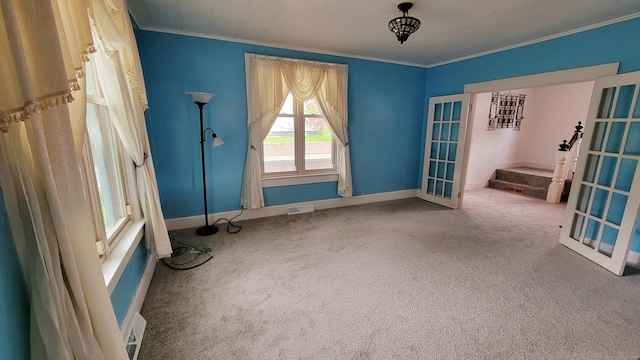 909 N Colony Rd, Meriden, CT 06450 - carpeted empty room featuring ornamental molding, baseboards, and french doors