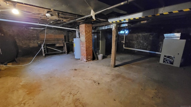 909 N Colony Rd, Meriden, CT 06450 - unfinished below grade area featuring gas water heater and oil tank
