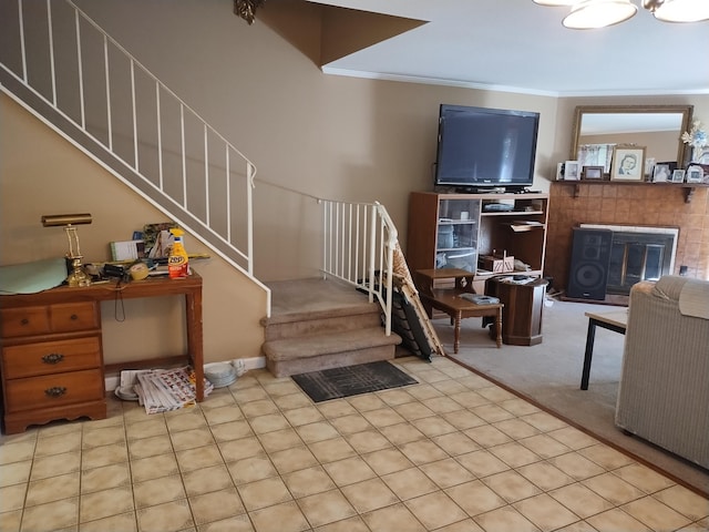 60 Engine House Rd Unit D, Stratford, CT 06614 - living area with stairs, crown molding, carpet floors, and a tile fireplace