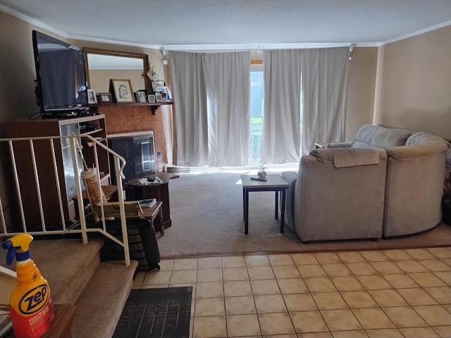 60 Engine House Rd Unit D, Stratford, CT 06614 - living room featuring ornamental molding, light carpet, a tiled fireplace, stairway, and light tile patterned floors