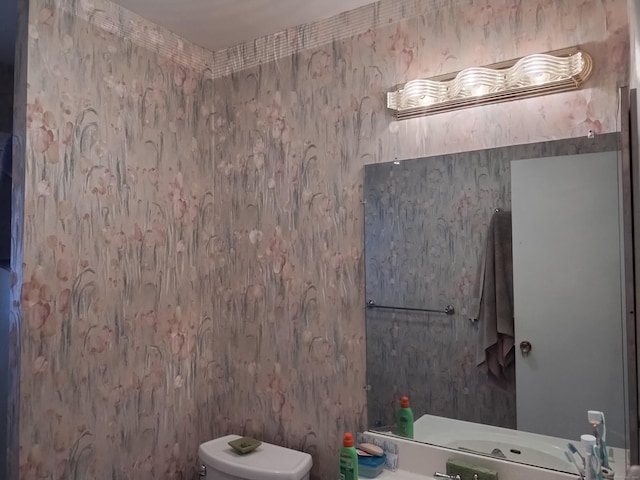 60 Engine House Rd Unit D, Stratford, CT 06614 - half bathroom featuring toilet and vanity