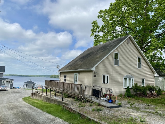 52 Lake View Ave, Salem, CT 06420 - view of side of home featuring a deck with water view and roof with shingles