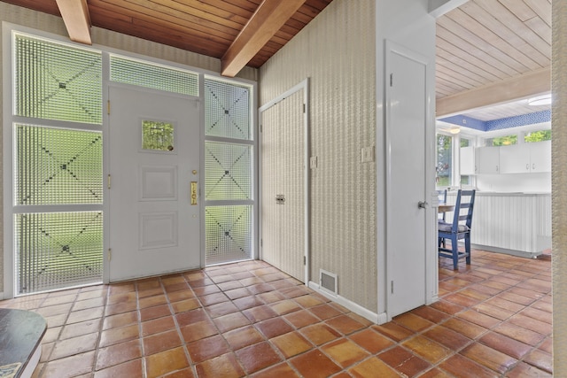1 Indian Spring Ln, Norwich, CT 06360 - tiled entryway featuring wood ceiling with exposed beams and healthy amount of natural light