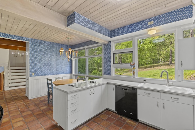 1 Indian Spring Ln, Norwich, CT 06360 - kitchen featuring black appliances, wallpapered walls, a chandelier, wooden ceiling with exposed beams, and a sink