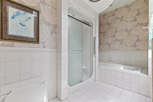 1 Indian Spring Ln, Norwich, CT 06360 - bathroom featuring wallpapered walls, toilet, tile walls, tile patterned flooring, and a shower
