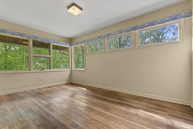 1 Indian Spring Ln, Norwich, CT 06360 - unfurnished room with plenty of natural light, baseboards, and wood-type flooring