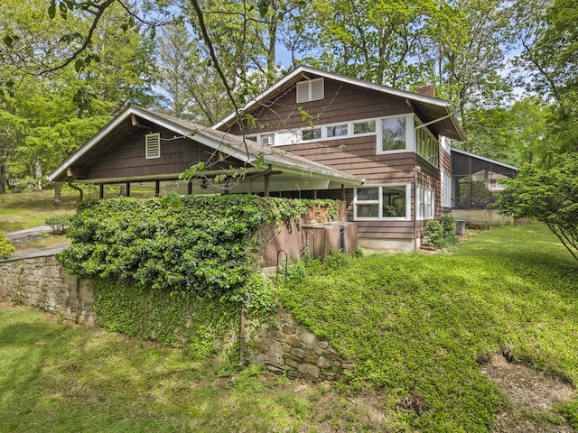 1 Indian Spring Ln, Norwich, CT 06360 - view of front of property featuring a chimney and a front lawn