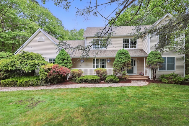 12 Silversmith Rd, Farmington, CT 06085 - traditional-style house with a front yard, roof with shingles, and a porch