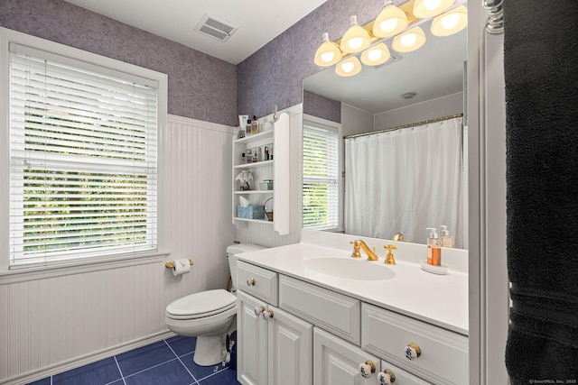 23 Mckeon Pl, Ridgefield, CT 06877 - full bathroom featuring tile patterned flooring, toilet, plenty of natural light, vanity, and wainscoting