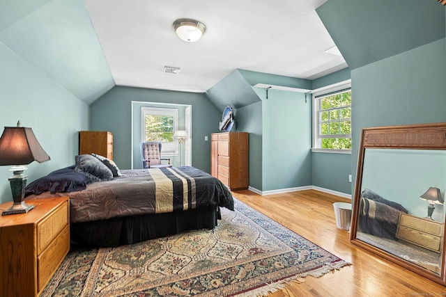 23 Mckeon Pl, Ridgefield, CT 06877 - bedroom with multiple windows, wood finished floors, lofted ceiling, and baseboards