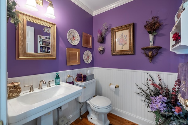 23 Mckeon Pl, Ridgefield, CT 06877 - half bathroom featuring a wainscoted wall, wood finished floors, toilet, and ornamental molding