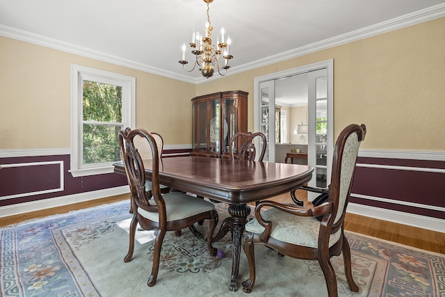 23 Mckeon Pl, Ridgefield, CT 06877 - dining room featuring a chandelier, wood finished floors, crown molding, and baseboards