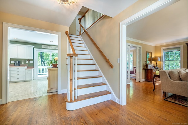 23 Mckeon Pl, Ridgefield, CT 06877 - stairway with wood finished floors, baseboards, and ornamental molding