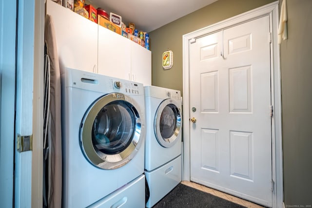 23 Mckeon Pl, Ridgefield, CT 06877 - laundry room featuring washer and clothes dryer, cabinet space, and light tile patterned floors