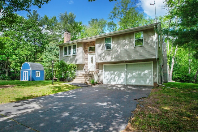 69 Fernwood Dr, Simsbury, CT 06070 - raised ranch featuring a garage, driveway, a front lawn, and a chimney