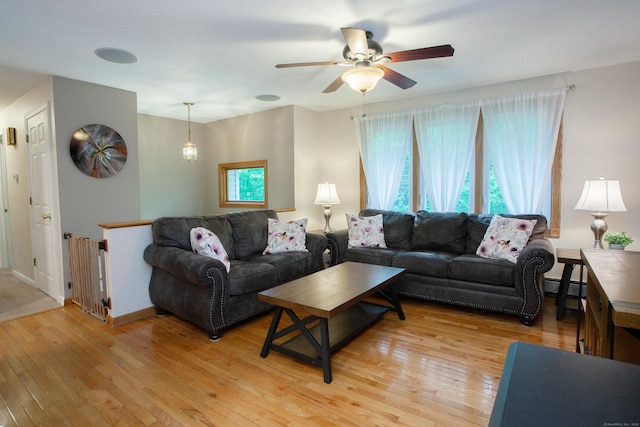 69 Fernwood Dr, Simsbury, CT 06070 - living room with light wood finished floors, a ceiling fan, and a baseboard radiator