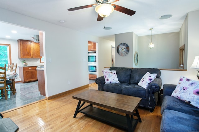 69 Fernwood Dr, Simsbury, CT 06070 - living area featuring light wood-type flooring, ceiling fan, and baseboards