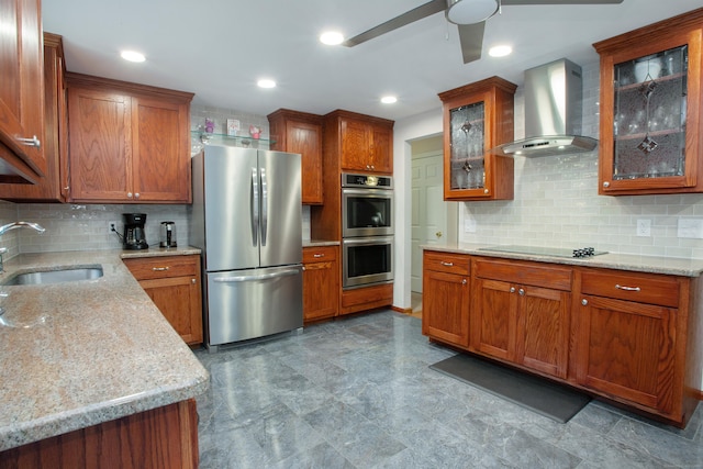 69 Fernwood Dr, Simsbury, CT 06070 - kitchen with stainless steel appliances, wall chimney range hood, a sink, a ceiling fan, and brown cabinetry