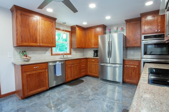 69 Fernwood Dr, Simsbury, CT 06070 - kitchen with appliances with stainless steel finishes, a sink, brown cabinets, a ceiling fan, and recessed lighting