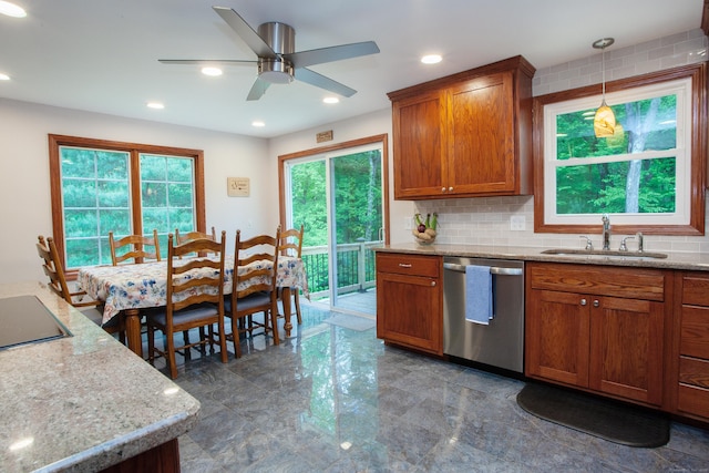 69 Fernwood Dr, Simsbury, CT 06070 - kitchen featuring stainless steel dishwasher, a sink, decorative backsplash, brown cabinetry, and a ceiling fan