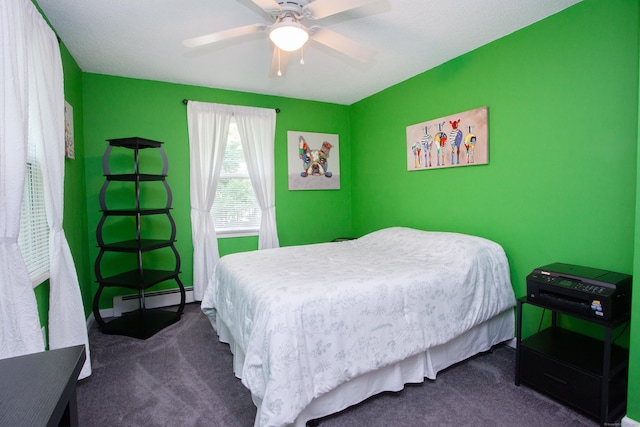 69 Fernwood Dr, Simsbury, CT 06070 - bedroom featuring dark colored carpet, a baseboard heating unit, and a ceiling fan