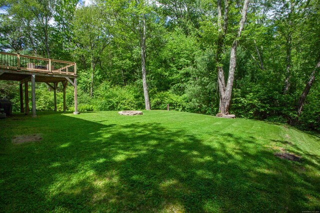 69 Fernwood Dr, Simsbury, CT 06070 - view of green lawn with a wooden deck
