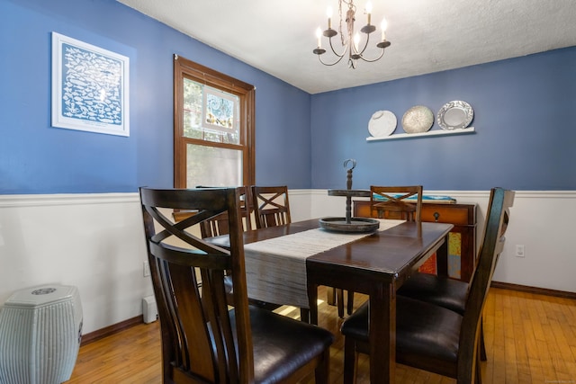 2 Latimer Ct, Waterford, CT 06385 - dining room with a chandelier, light wood-style flooring, and baseboards