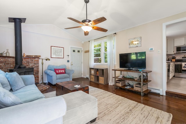 2 Latimer Ct, Waterford, CT 06385 - living room with a wood stove, wood finished floors, a baseboard heating unit, a ceiling fan, and vaulted ceiling