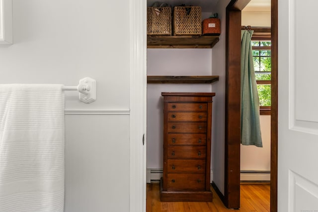 2 Latimer Ct, Waterford, CT 06385 - bathroom featuring wood finished floors and a baseboard heating unit