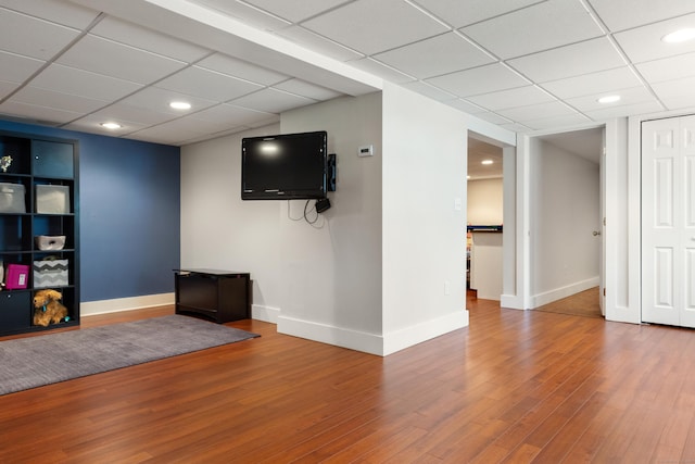 2 Latimer Ct, Waterford, CT 06385 - unfurnished living room featuring wood finished floors, a paneled ceiling, baseboards, and recessed lighting