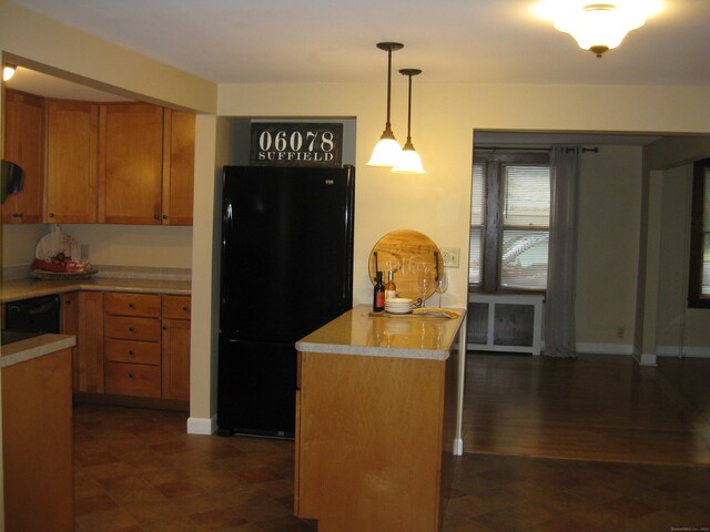 1071 River Blvd, Suffield, CT 06078 - kitchen featuring black appliances, light countertops, hanging light fixtures, and brown cabinets