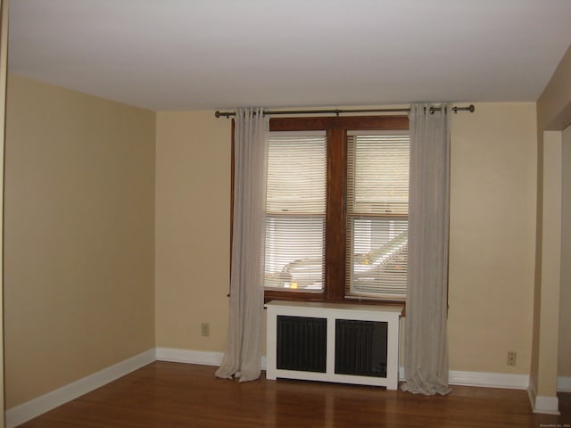 1071 River Blvd, Suffield, CT 06078 - unfurnished room with radiator, wood finished floors, and baseboards