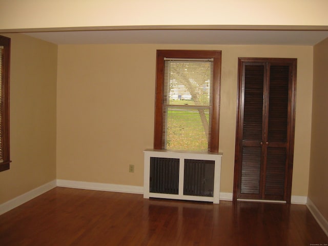 1071 River Blvd, Suffield, CT 06078 - spare room featuring radiator heating unit, wood finished floors, and baseboards