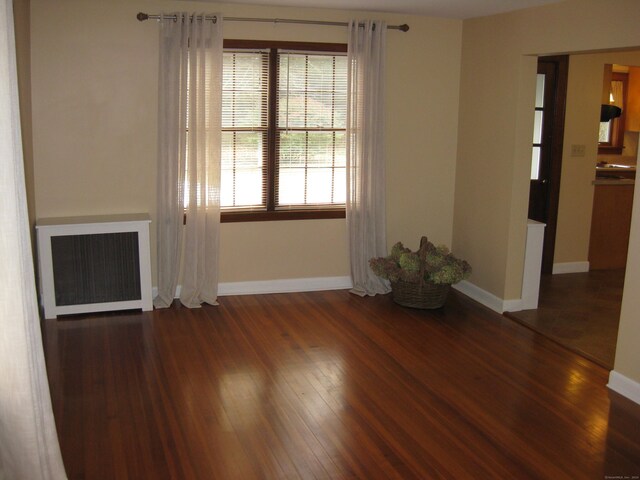 1071 River Blvd, Suffield, CT 06078 - unfurnished living room with baseboards and wood finished floors