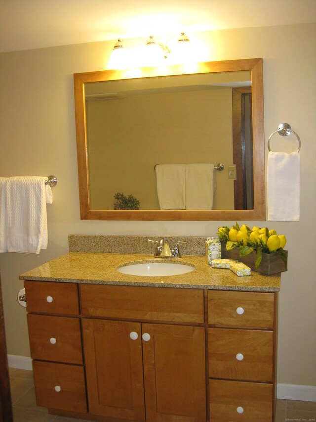 1071 River Blvd, Suffield, CT 06078 - bathroom featuring vanity, tile patterned flooring, and baseboards