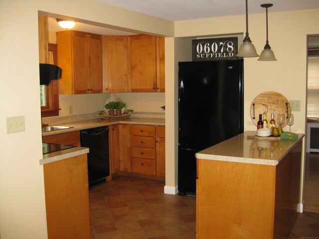 1071 River Blvd, Suffield, CT 06078 - kitchen featuring black appliances, decorative light fixtures, light countertops, extractor fan, and brown cabinetry