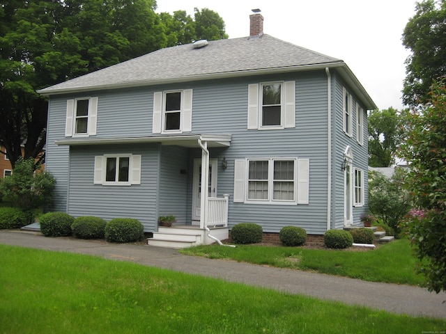 1071 River Blvd, Suffield, CT 06078 - view of front facade featuring a chimney, a front yard, and roof with shingles