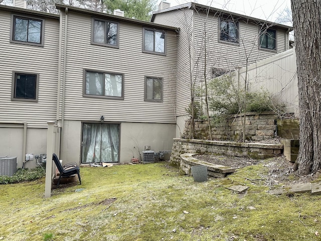 47 Conestoga Way Unit 47, Glastonbury, CT 06033 - rear view of property featuring central AC, a yard, and a chimney