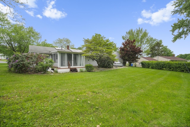 34 Benedict Dr, South Windsor, CT 06074 - view of green lawn featuring a sunroom