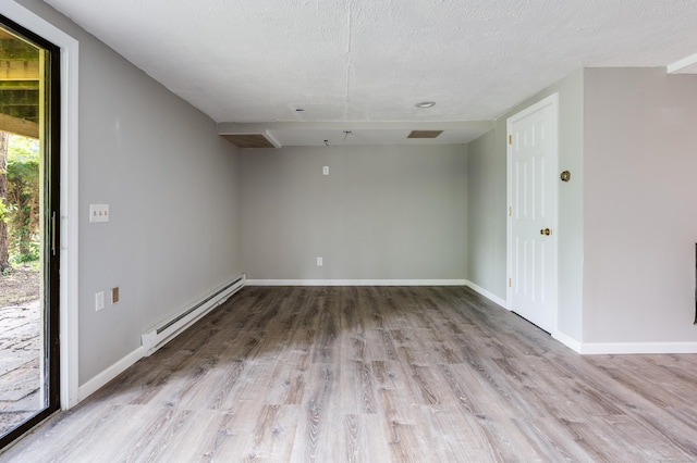143 Clark Hill Rd, East Haddam, CT 06423 - unfurnished room featuring baseboard heating, wood finished floors, a textured ceiling, and baseboards