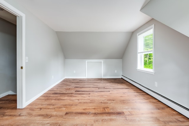 143 Clark Hill Rd, East Haddam, CT 06423 - bonus room featuring baseboard heating, vaulted ceiling, wood finished floors, and baseboards