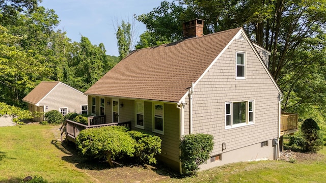 143 Clark Hill Rd, East Haddam, CT 06423 - view of front facade with a chimney, a shingled roof, and a front yard