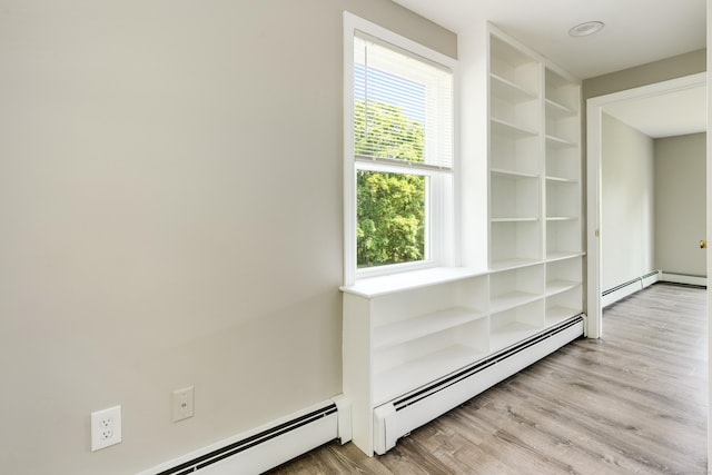 143 Clark Hill Rd, East Haddam, CT 06423 - hallway with plenty of natural light, light wood finished floors, and baseboard heating