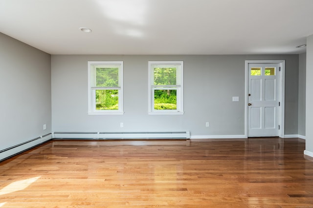 143 Clark Hill Rd, East Haddam, CT 06423 - unfurnished room with healthy amount of natural light, baseboards, light wood finished floors, baseboard heating, and recessed lighting